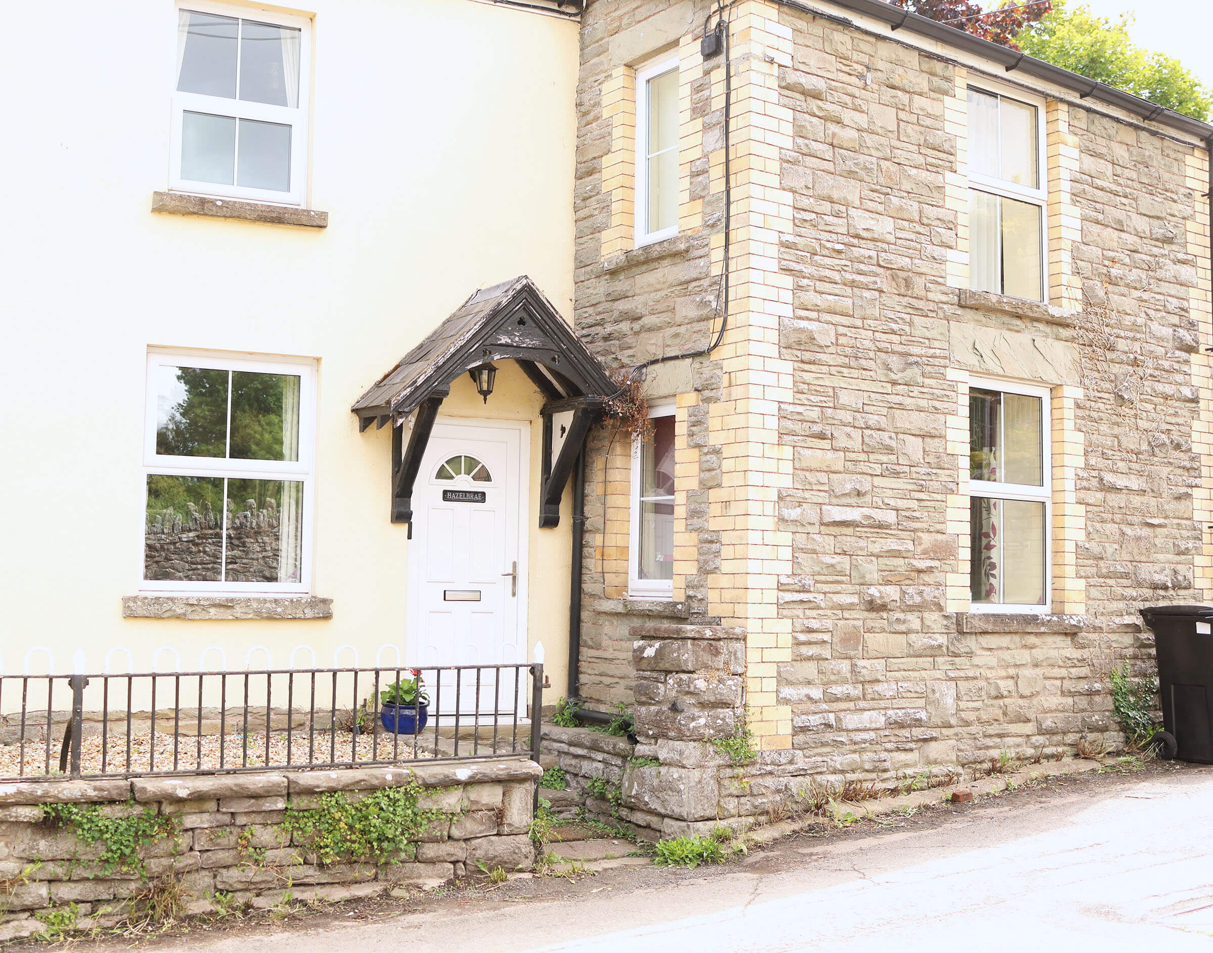 Exterior view of The Hay Holiday Cottage with garden and front entrance
